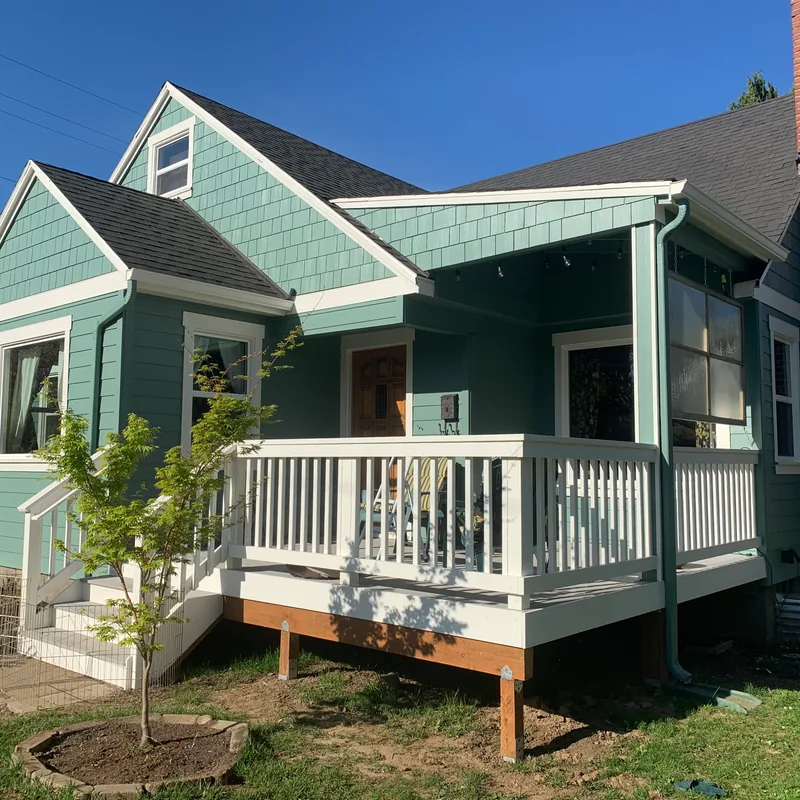 Bungalow after new shingle and lap siding, trim and a rebuilt front porch