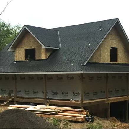 House wrap and flashing installed before new siding goes on