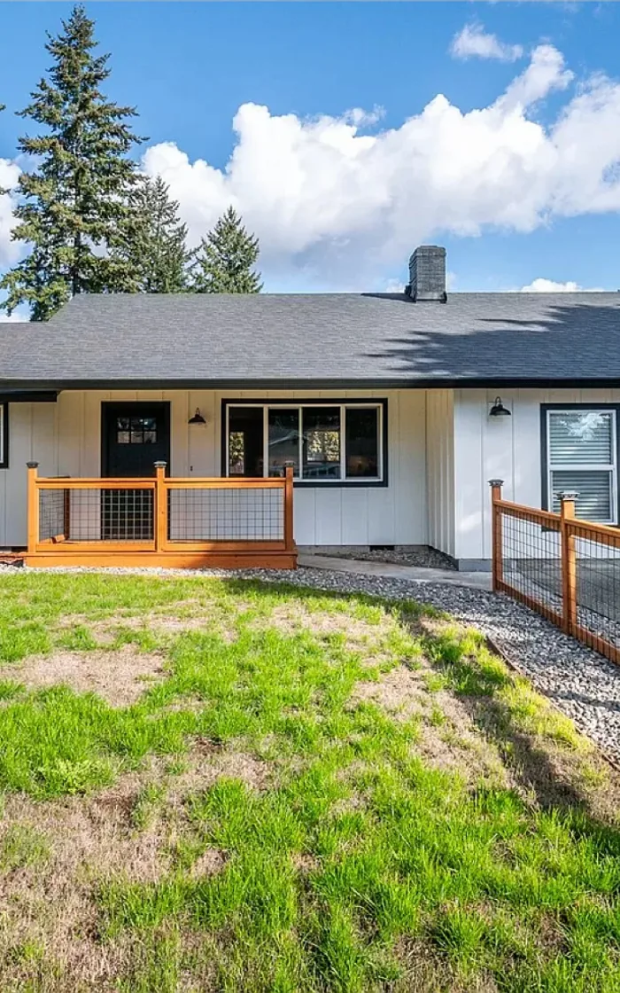 New composition roof, gutters and board-and-batten siding on a ranch home