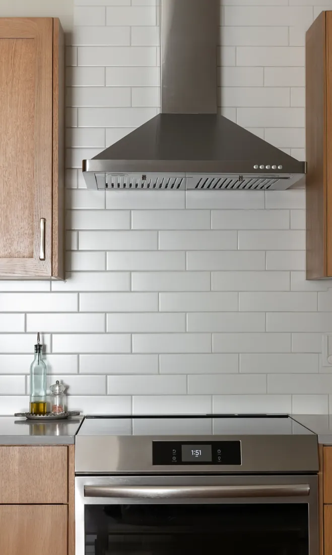 Range hood and subway tile backsplash