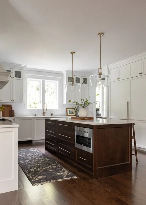 Stained wood island with deep drawers and a built-in microwave drawer, set on dark oak hardwood floors — Felida, Vancouver, WA