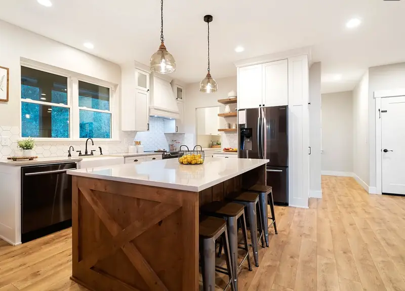 Craftsman kitchen with a barn-X island, quartz counters, and glass pendant lights — Battle Ground, WA