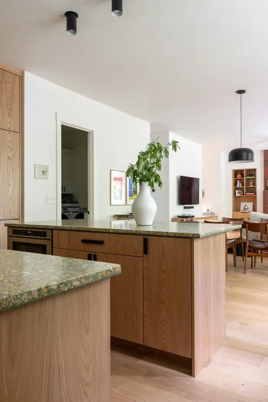 The oak island seen from the kitchen looking through to the living and dining rooms beyond