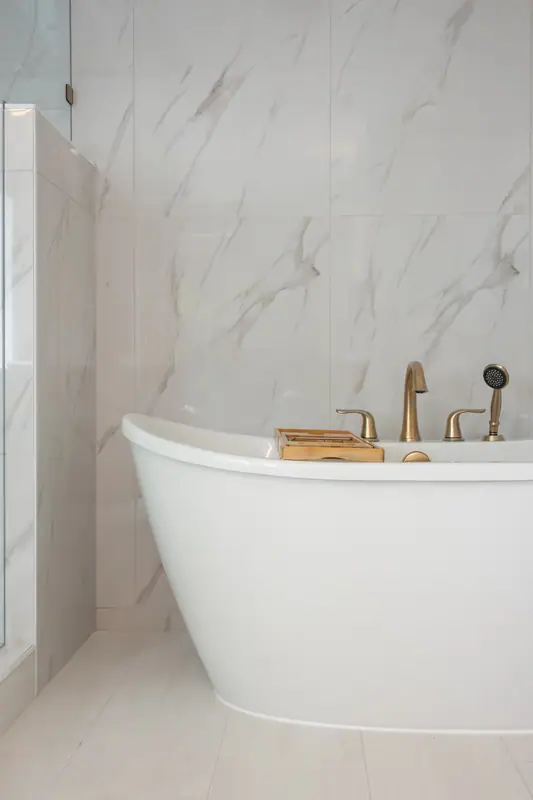 Freestanding tub set into the alcove the oversized jetted tub used to occupy