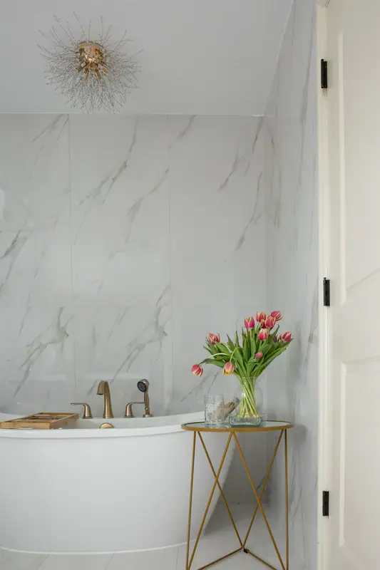Matching powder room finished in the same transitional palette