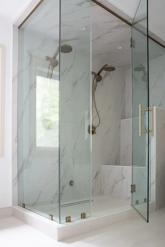 Built-in shower bench and recessed shampoo niche in large-format tile