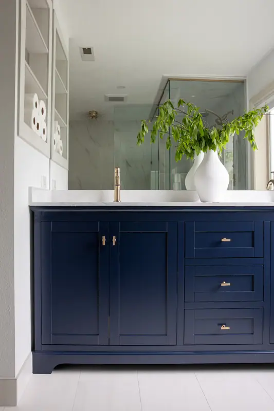Recessed niche shelving beside the vanity for towel and tissue storage