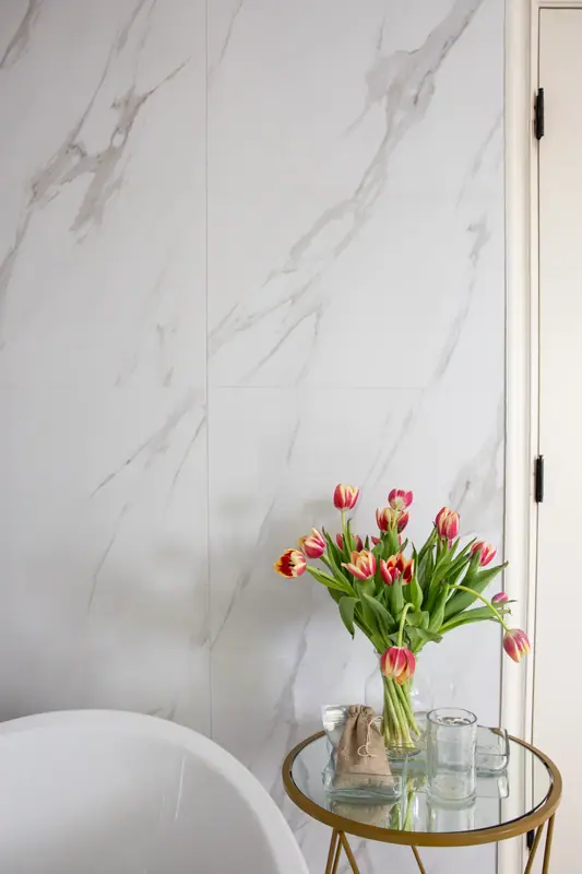Tile transition between the shower enclosure and the tub alcove