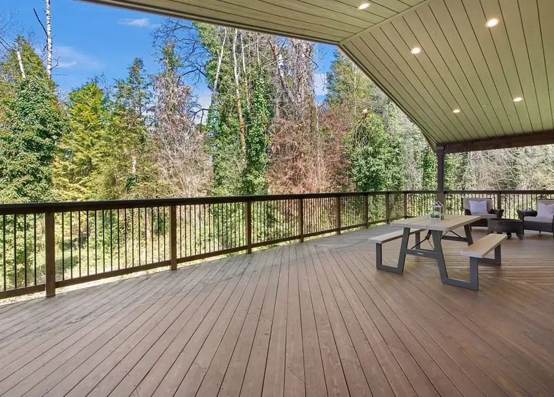 Covered deck looking out over the wooded ravine behind the house — Vancouver, WA