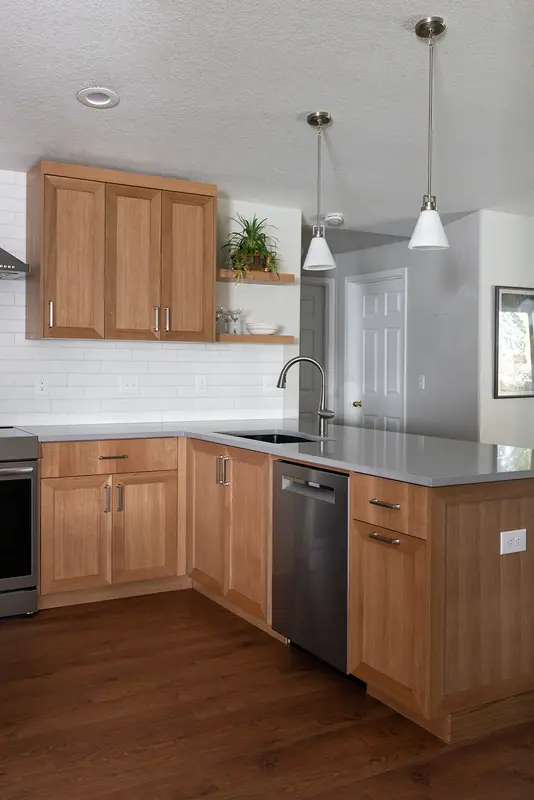 The finished kitchen looking across the peninsula to the range wall