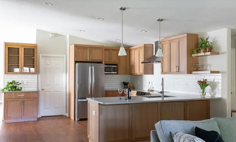 The open-plan kitchen and living room after the remodel