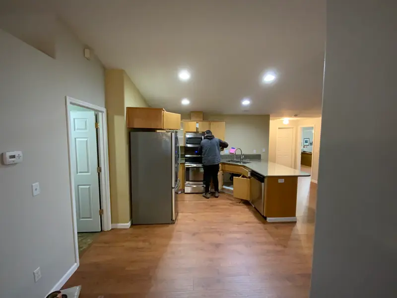 Before the remodel: the cramped corner sink and the narrow counter run beside the range