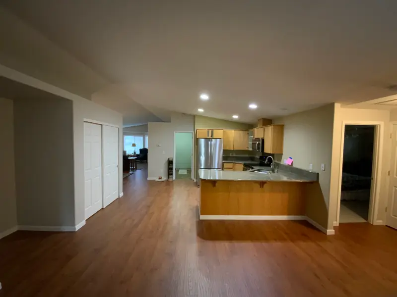 Before the remodel: the dark original kitchen and the hall closet that later became the pantry