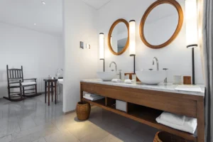 A beautiful sunset over a calm ocean with vibrant orange and pink hues reflecting on the water.